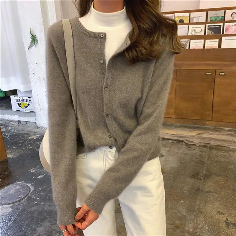 Single Breasted Solid Round Neck Knitted Cardigan

Modified Title: One Buttoned Plain Circular Neck Knitted Cardigan – view 2