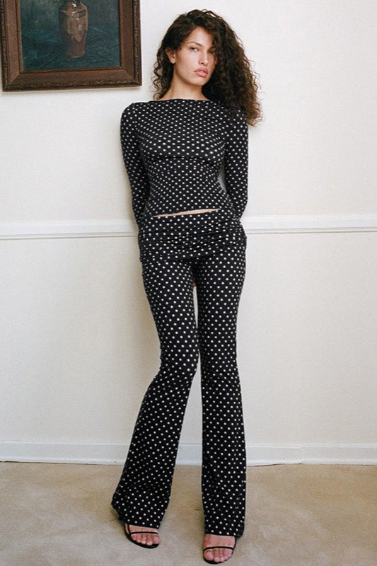 Woman wearing Off-Shoulder Polka Flare-Sleeve Set from Hicosy