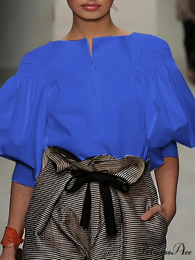 Lantern Quarter Sleeve Button Round Neck Blouse

Modified Title: Lantern One-fourth Sleeve Button Circular Neck Blouse