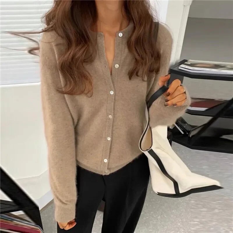 Single Breasted Solid Round Neck Knitted Cardigan

Modified Title: One Buttoned Plain Circular Neck Knitted Cardigan – view 11