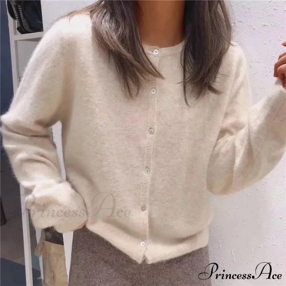 Single Breasted Solid Round Neck Knitted Cardigan

Modified Title: One Buttoned Plain Circular Neck Knitted Cardigan