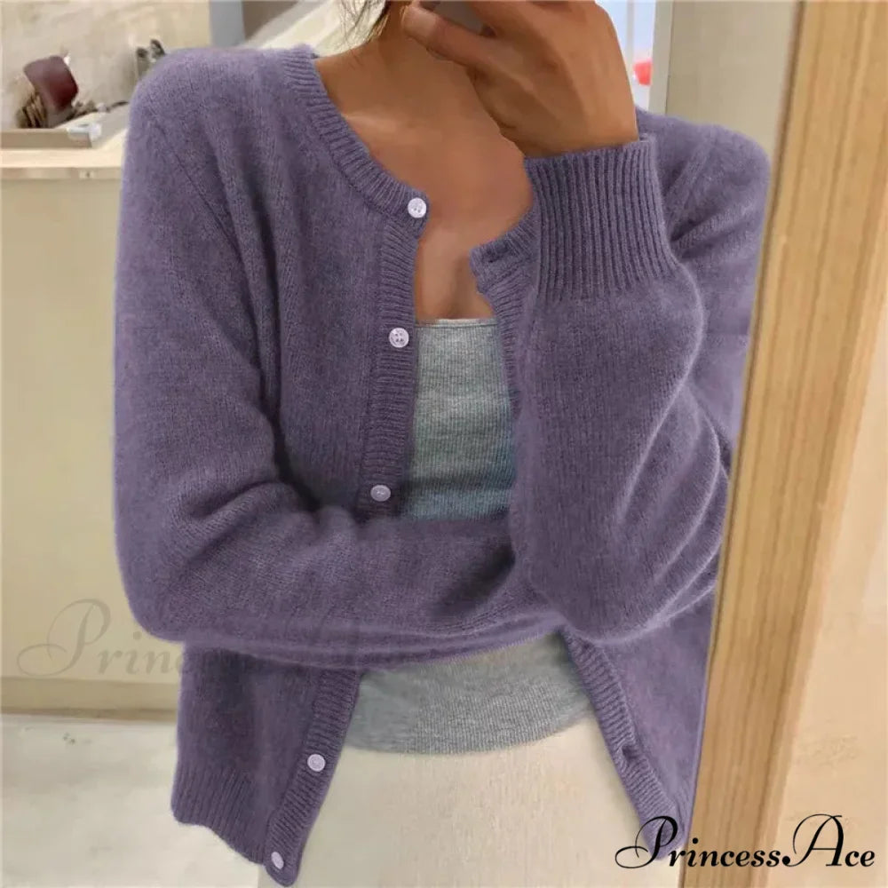 Single Breasted Solid Round Neck Knitted Cardigan

Modified Title: One Buttoned Plain Circular Neck Knitted Cardigan