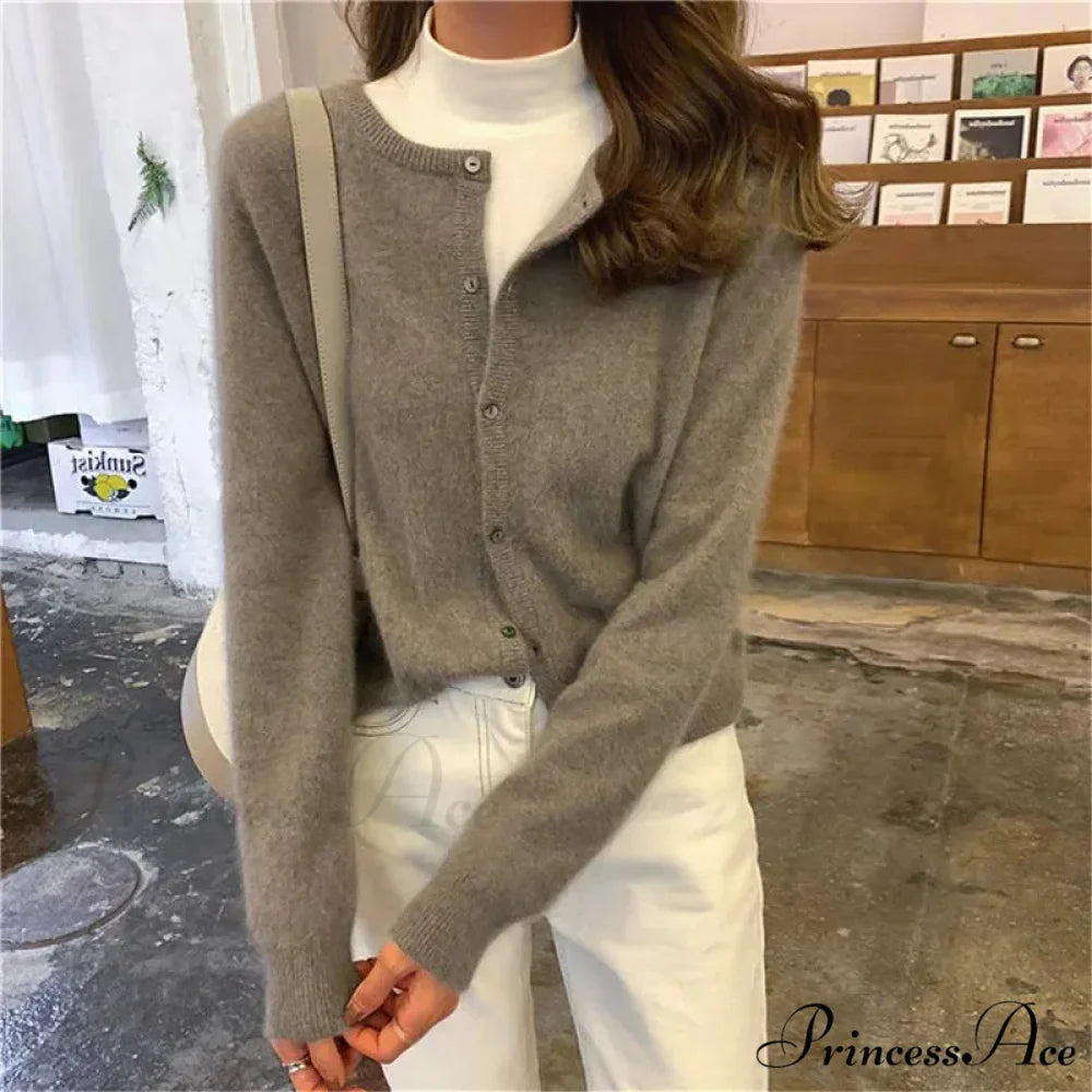 Single Breasted Solid Round Neck Knitted Cardigan

Modified Title: One Buttoned Plain Circular Neck Knitted Cardigan