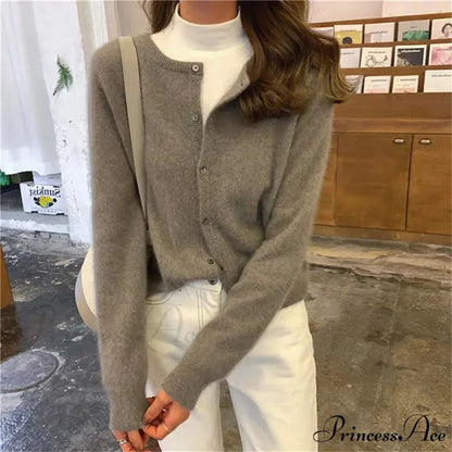 Single Breasted Solid Round Neck Knitted Cardigan

Modified Title: One Buttoned Plain Circular Neck Knitted Cardigan