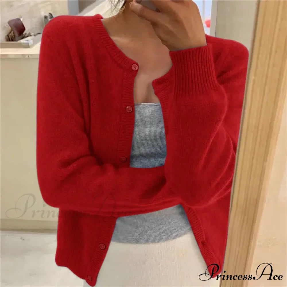 Single Breasted Solid Round Neck Knitted Cardigan

Modified Title: One Buttoned Plain Circular Neck Knitted Cardigan