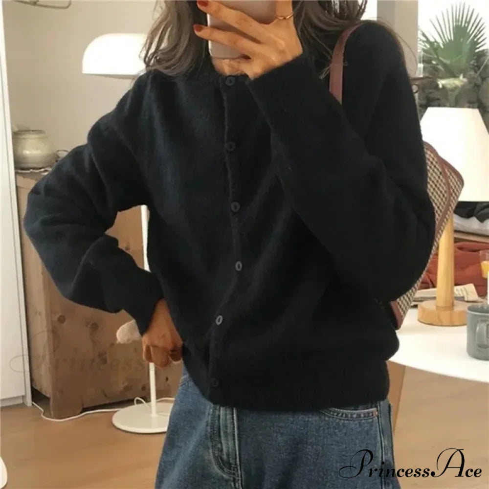 Single Breasted Solid Round Neck Knitted Cardigan

Modified Title: One Buttoned Plain Circular Neck Knitted Cardigan