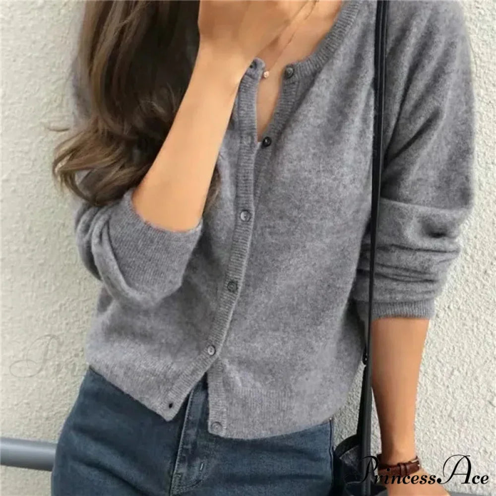 Single Breasted Solid Round Neck Knitted Cardigan

Modified Title: One Buttoned Plain Circular Neck Knitted Cardigan