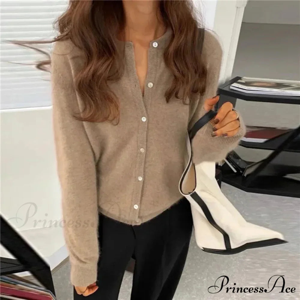 Single Breasted Solid Round Neck Knitted Cardigan

Modified Title: One Buttoned Plain Circular Neck Knitted Cardigan