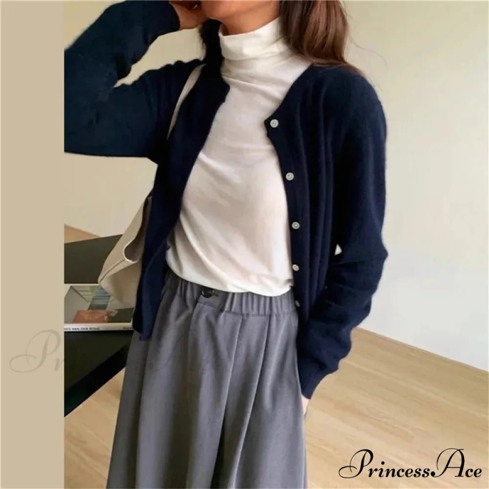 Single Breasted Solid Round Neck Knitted Cardigan

Modified Title: One Buttoned Plain Circular Neck Knitted Cardigan