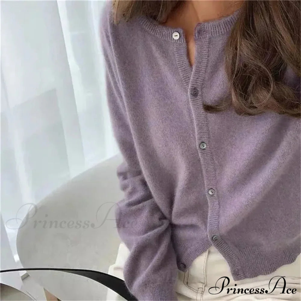 Single Breasted Solid Round Neck Knitted Cardigan

Modified Title: One Buttoned Plain Circular Neck Knitted Cardigan