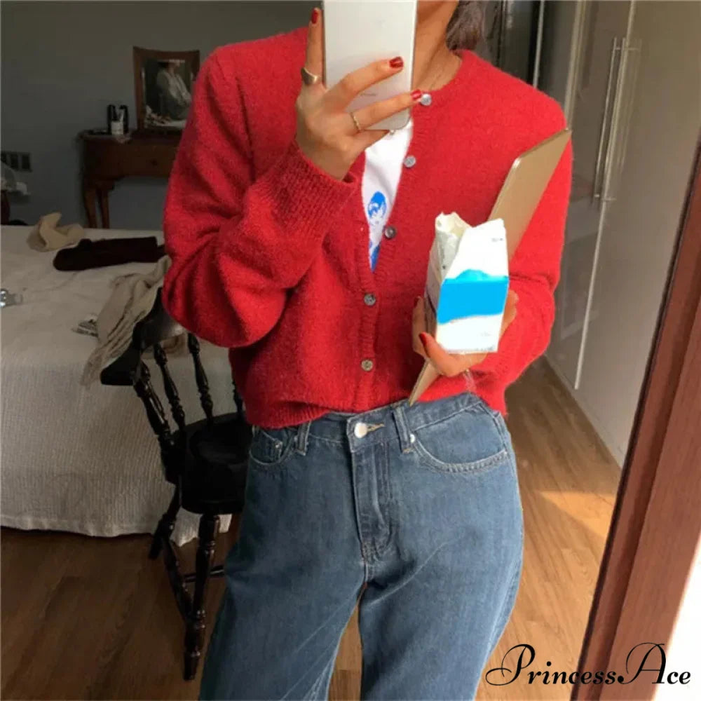 Single Breasted Solid Round Neck Knitted Cardigan

Modified Title: One Buttoned Plain Circular Neck Knitted Cardigan