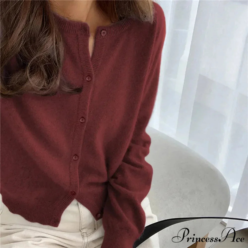 Single Breasted Solid Round Neck Knitted Cardigan

Modified Title: One Buttoned Plain Circular Neck Knitted Cardigan