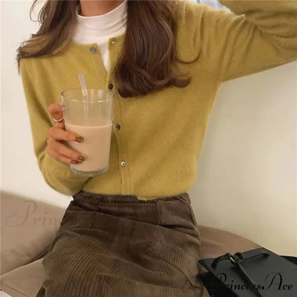 Single Breasted Solid Round Neck Knitted Cardigan

Modified Title: One Buttoned Plain Circular Neck Knitted Cardigan