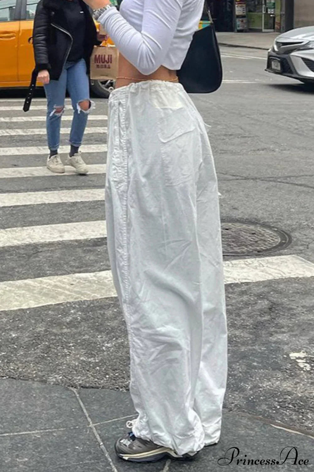 Woman wearing Woven Wide-Leg Multi-Pocket Cargos from Hicosy — view 2